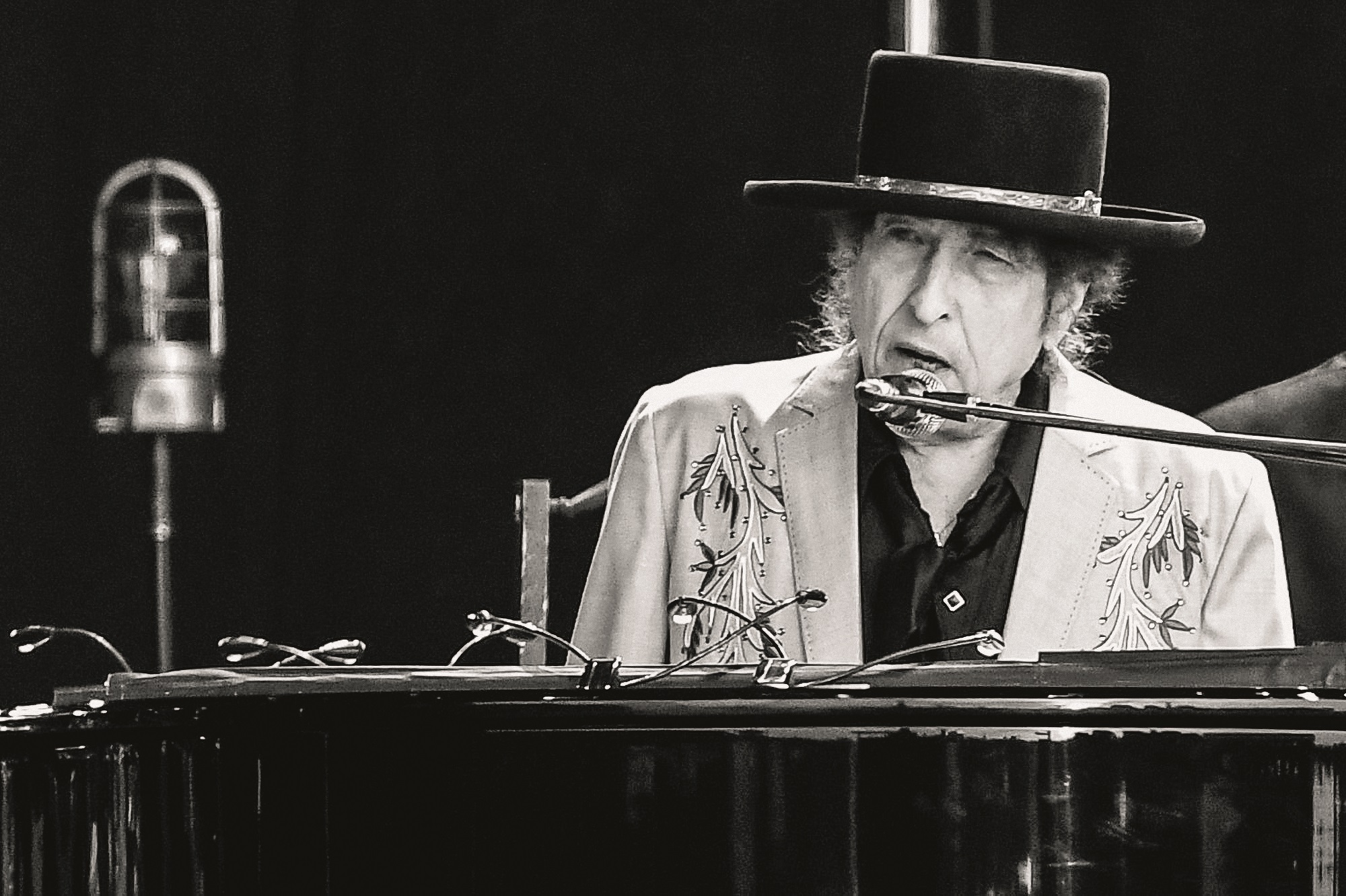 LONDON, ENGLAND - JULY 12: Editors note - image converted to black and white: Bob Dylan performs as part of a double bill with Neil Young at Hyde Park on July 12, 2019 in London, England. (Photo by Dave J Hogan/Getty Images for ABA)